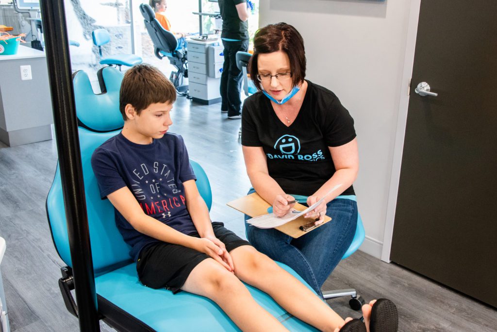 David Ross staff talking with a patient