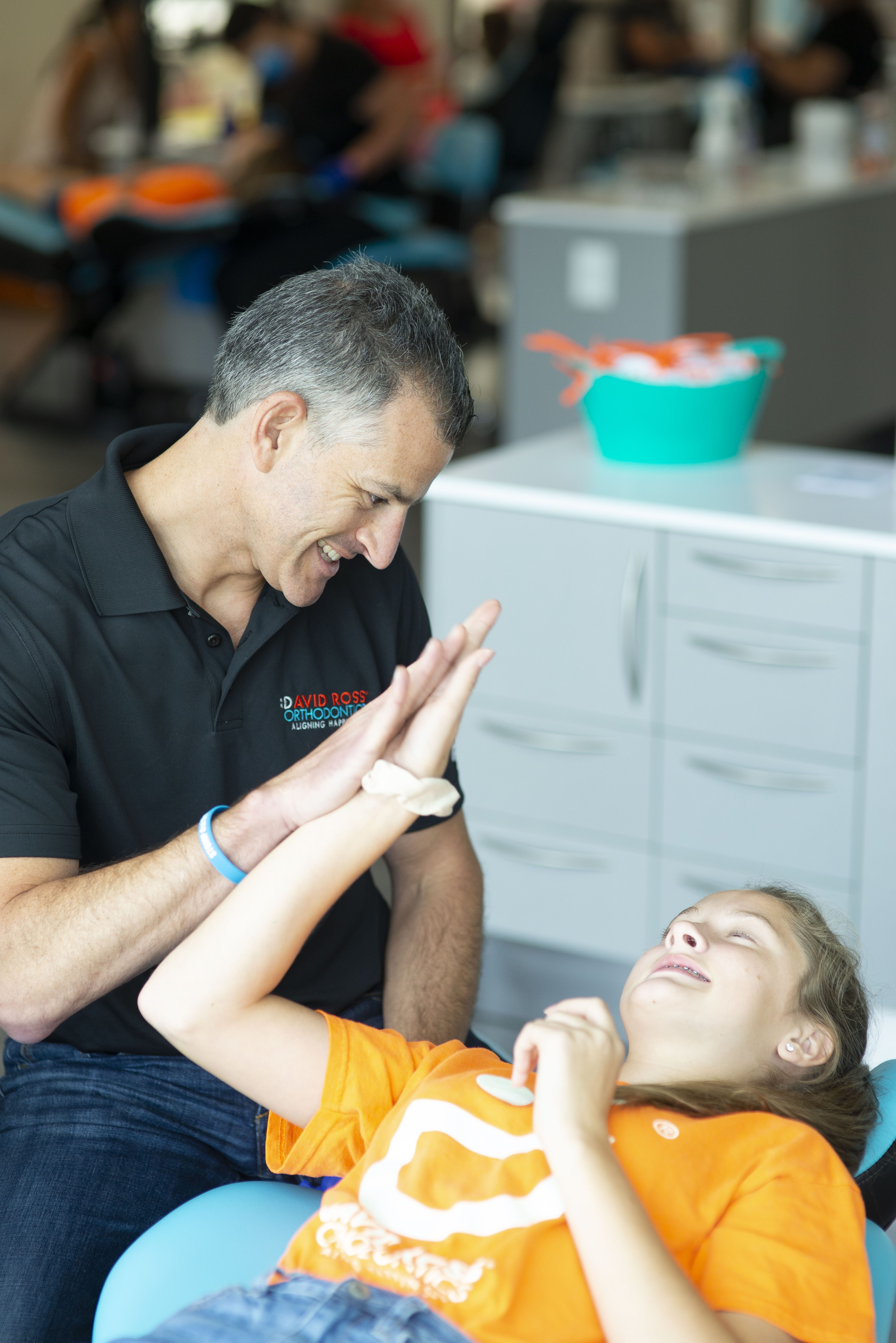 David Ross giving a high five to a patient